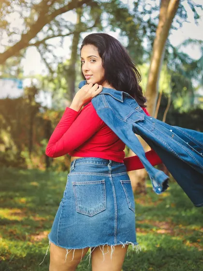 A dynamic shot with a denim jacket in motion. This adds energy and a sense of freedom to a casual outdoor portfolio shoot.