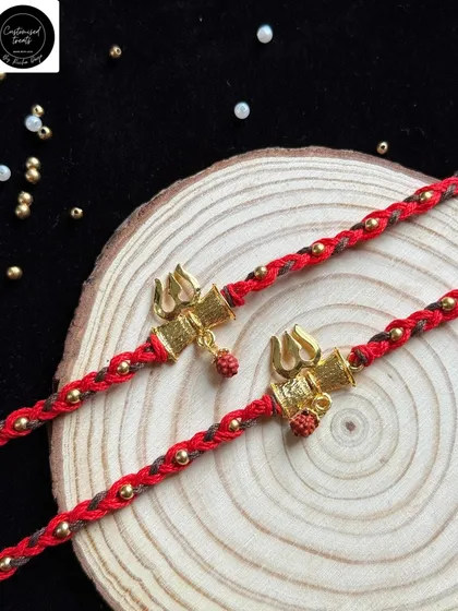 For a bond that is spiritual and strong, my Trishul and Damru rakhi is a perfect choice. This minimal yet powerful design is handcrafted with a sacred thread, symbolizing protection and divine blessings.