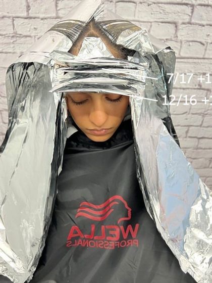 All foils are in. This placement ensures that the Honey Beige Blonde highlights are perfectly distributed throughout the hair.