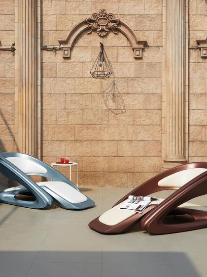 Two FusionWAVE chairs in different finishes, blue and brown. The design is customizable to fit any aesthetic, from bold and modern to warm and classic.