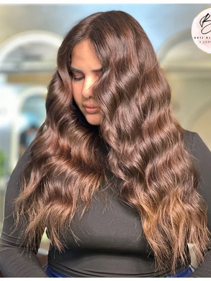 A side profile highlighting the beautiful flow and rich tones of the hair.
