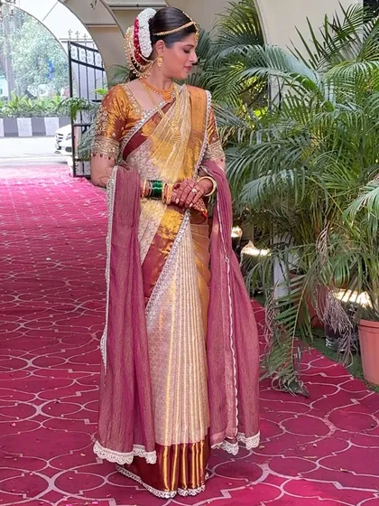 For this bride, we created beautiful fluffy pleats for her Kanjivaram silk saree. This style gives the saree wonderful volume and a grand look, perfect for a traditional wedding ceremony. You can see how each pleat is defined and falls perfectly.