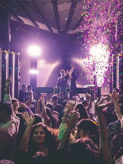 Another angle of the madness at FLO. The purple lights, the confetti, and the crowd with their hands up create an unforgettable visual.
