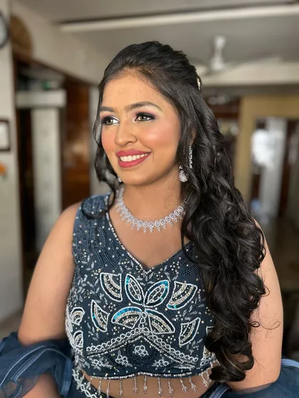 A candid, happy moment. The client looks absolutely radiant and ready to dance the night away.