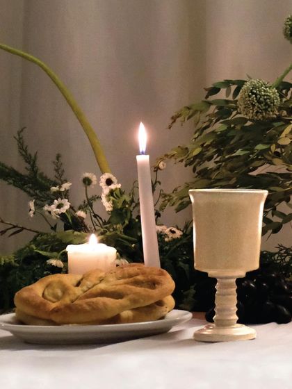 A beautifully styled table featuring one of our custom-designed ceramic goblets. These were created to elevate the enjoyment of fine food and drink.