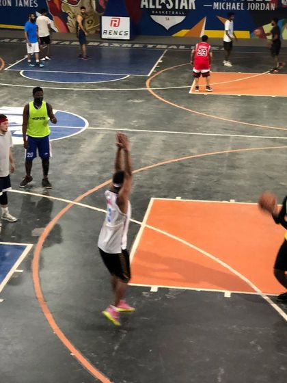 Players setting up for a shot during a rental session. Our facility is open until 9 PM, so you can always find time for an evening game.