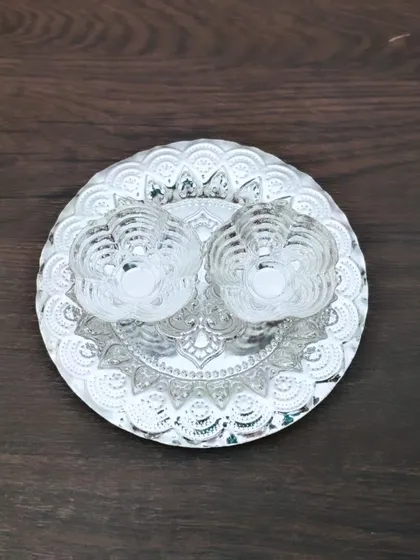 A German silver plate with two lotus-shaped glass diya holders, a simple yet beautiful piece for your daily prayers.