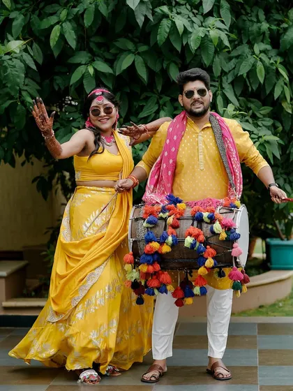 The energy of a Haldi ceremony is contagious! We love seeing our couples, like Sukriti and Rahul, have the time of their lives, complete with dhol players and colorful decor that matches their joyful spirit.