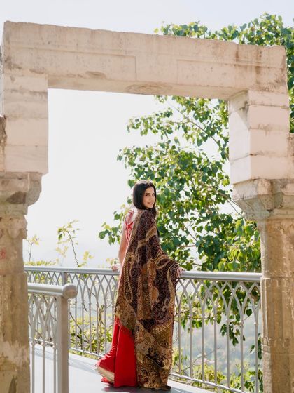 A beautiful shot looking back, with the paisley-printed dupatta elegantly draped over my shoulder.