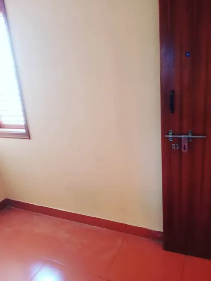 A good paint job is all about the details. Here you can see the clean, smooth finish on the wall next to a freshly polished wooden door. I make sure every part of the job, from the walls to the woodwork, is done right.