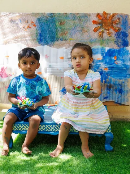 The proud faces of young artists with their finished work. My goal is to create a nurturing space where children feel empowered to explore their creativity and feel a sense of accomplishment.