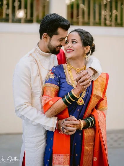An intimate portrait of Sayali and Gaurav on their wedding day. The way they hold each other speaks of a deep and comfortable love, beautifully framed by their traditional Maharashtrian wedding attire.