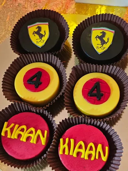 Custom chocolate-covered Oreos with the Ferrari logo and the birthday boy's name.