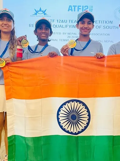 Victory for our young champions. NTC coach Asha Sharma and the Indian girls' team display their gold medals and the national flag after winning the South Asian U-12 Tennis Championship in Nepal.
