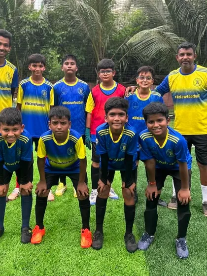 The U13 team and their coaches, ready for the next challenge after a strong tournament showing.