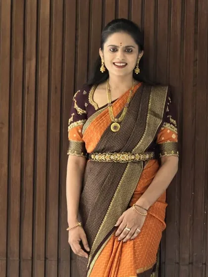 Our lovely client looking elegant in her pure Mysore crepe silk saree. The traditional jewelry perfectly complements the saree's classic design.