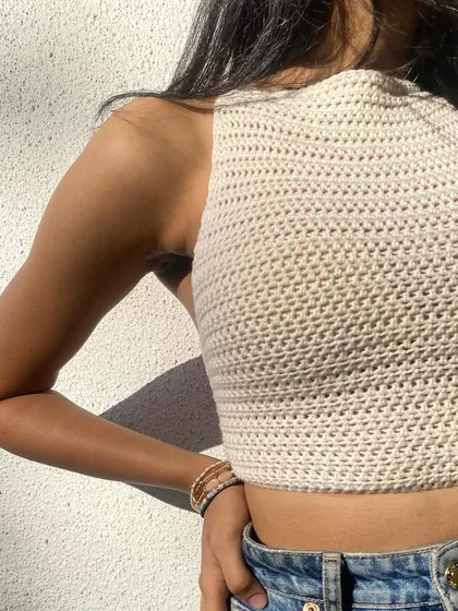 A detailed shot of the neckline on our halter top. The tight crochet stitch provides a supportive and structured fit.