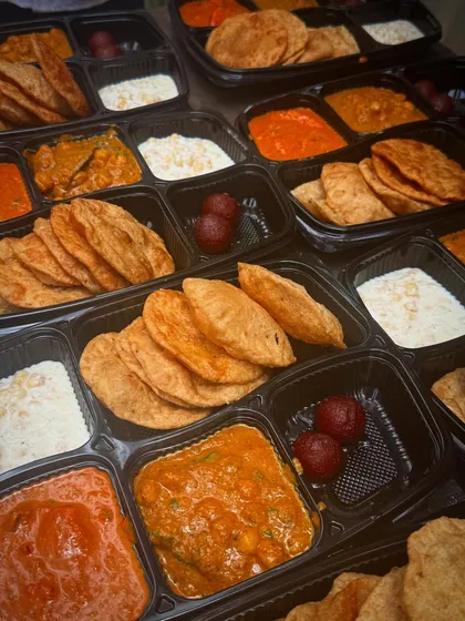 Here's a look at a bulk order of my Jain thalis, packed and ready for delivery. Each meal is sealed in a spill-proof container to keep the food fresh, warm, and neatly separated.