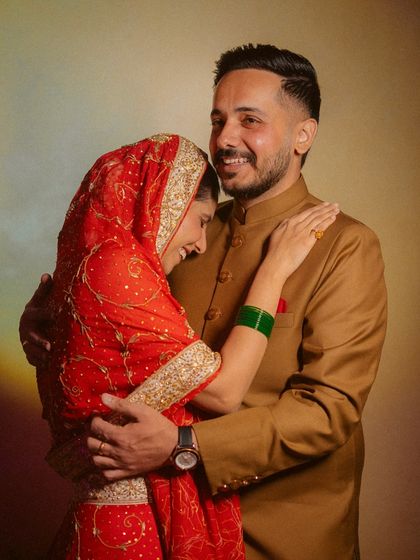 A warm and joyful portrait of a couple sharing a happy embrace.