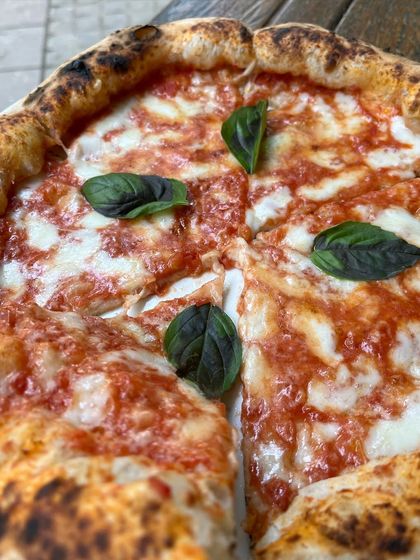 Classic. Timeless. Delicious. Our Margherita pizza is all three.