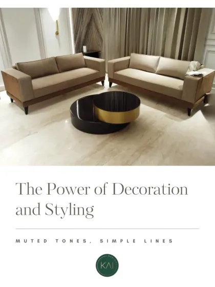 This living room set showcases the power of muted tones and simple lines. We paired two beige sofas with a unique two-tiered circular coffee table featuring black and brushed gold finishes, creating a calm yet sophisticated space.