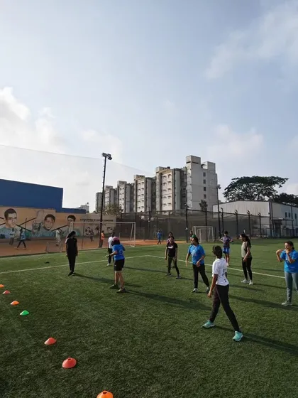 A wide shot of our members participating in a game on the turf. Our Sports Day was held at a great facility that allowed us to play a variety of games.