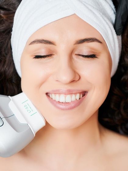 This image shows a HIFU treatment in progress. This non-surgical facelift technology uses focused ultrasound to lift and firm the skin on the jawline, cheeks, and neck, delivering natural-looking results.