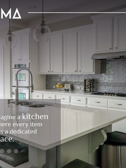 Imagine a kitchen where every item has a dedicated place. This classic white kitchen uses deep drawers, a large island, and custom cabinetry to create a clutter-free dream, making your cooking experience stress-free.