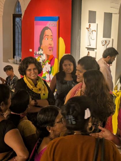 Laughter and conversation fill the room at a gallery event. It's a space where artists, activists, and community members meet as equals, breaking down barriers.