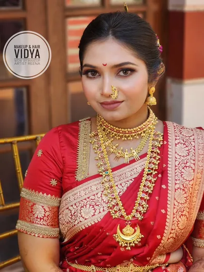 A close-up of Priya's bridal makeup by my artist Vidya. The look features defined eyes, a traditional bindi, and beautiful layered necklaces.