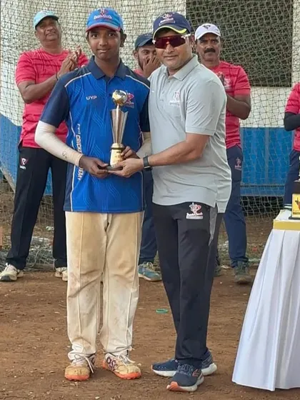 Dhruv Singh receives the Emerging Player award for the U-14 tournament.
