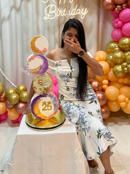 A candid moment of joy and surprise with my 25th birthday cake. Baking is my passion, and making my own birthday cake was the ultimate treat.