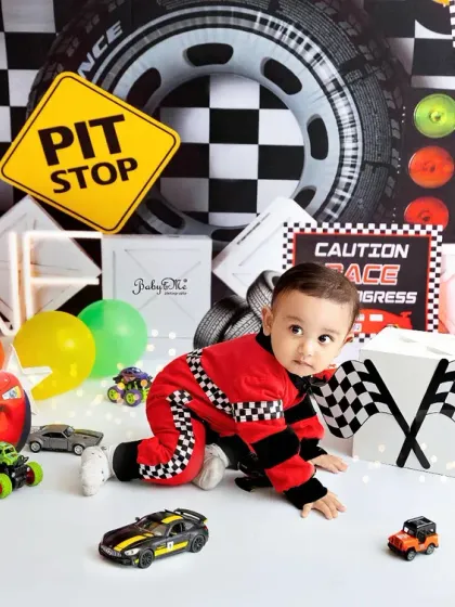 Exploring the race track from a different angle. The 'ONE' sign and checkered flags clearly mark this special first birthday milestone.