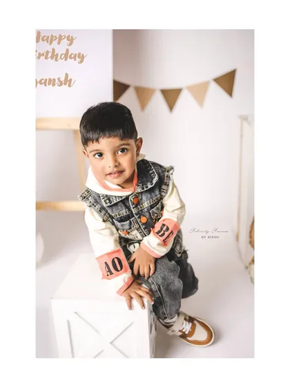 A stylish three-year-old posing for his birthday portrait. I love helping families choose outfits that match the theme and the child's personality.