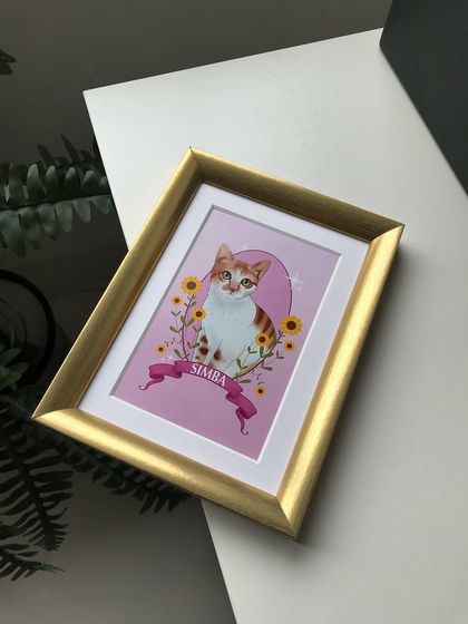 An angled shot of the framed Simba portrait. The gold frame catches the light beautifully, adding a dynamic quality to the display.