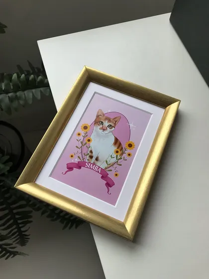 An angled shot of the framed Simba portrait. The gold frame catches the light beautifully, adding a dynamic quality to the display.