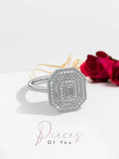 A Valentine’s exclusive from the "Pieces of You" collection. This octagonal ring is a statement of love, featuring a central emerald-cut diamond surrounded by multiple halos of brilliant pavé diamonds. It is as rare and special as your bond.