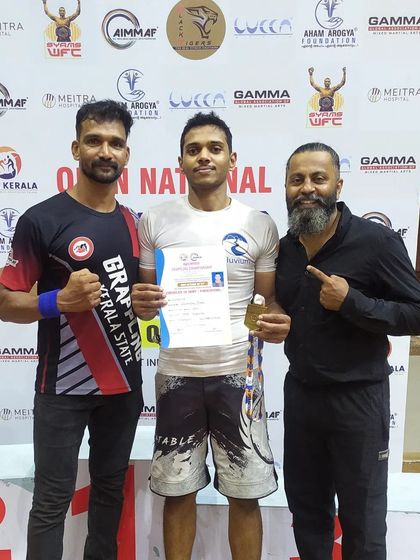 Receiving my Gold medal and prize at the Open National Grappling Championship in Kerala. I'm grateful for the support from my corner and the event organizers.