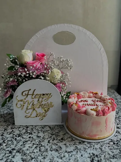 For Mother's Day, I offer more than just a cake. This gift set combines a beautiful custom cake with a fresh floral arrangement, creating a complete and elegant present that truly shows your appreciation.
