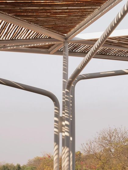 A detail of the outdoor roof at the rural school. The canopy is made of fifteen thousand 12-foot-long bamboo poles laid over a metal frame, creating a lightweight and visually playful structure.