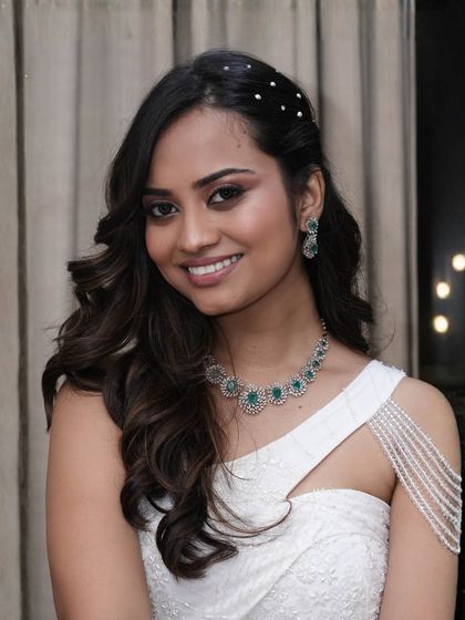 A smiling shot that shows how this soft makeup enhances her natural beauty without masking it. It's a look that whispers, not shouts.