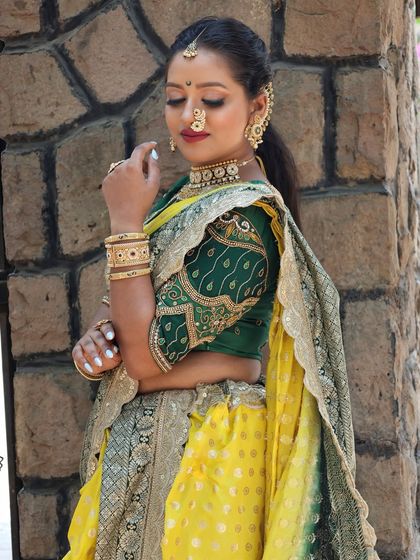 The unique peacock design on the blouse sleeve is clearly visible in this shot.