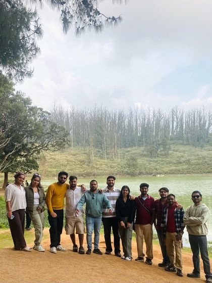 Our group by a serene lake in Ooty, enjoying the pleasant weather and beautiful scenery.