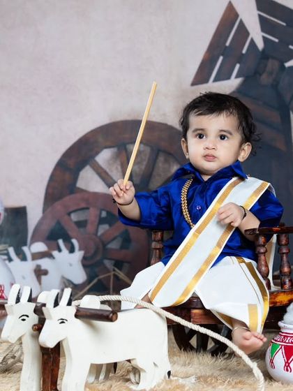 A determined little farmer ready to guide his bulls.