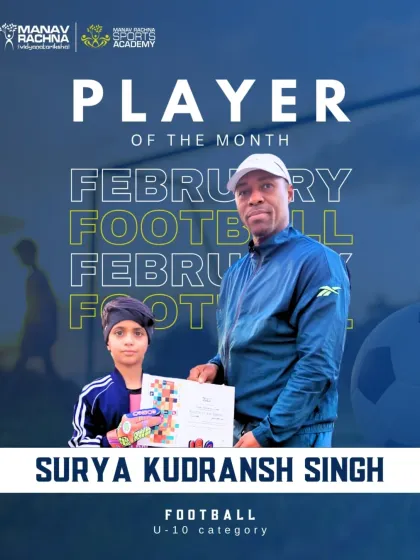 Surya Kudransh Singh, our Football Player of the Month for February (U-10), receiving his certificate from Coach Michael.