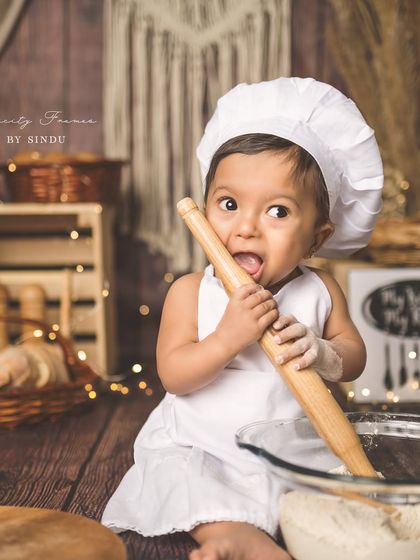 Another hilarious moment from the chef-themed shoot, where the rolling pin becomes a tasty snack.