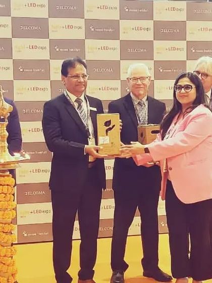 A dignitary receives a token of appreciation during the felicitation ceremony.