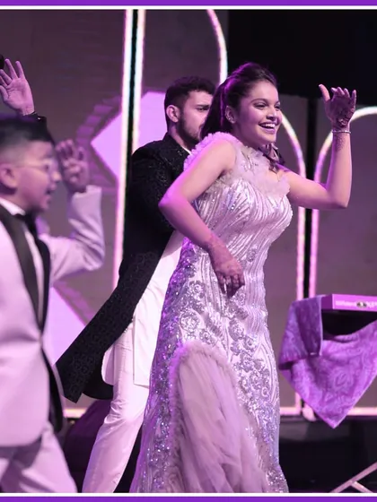 The bride and her friends enjoying their performance on the Sangeet stage. These are the moments of pure joy we love to create.