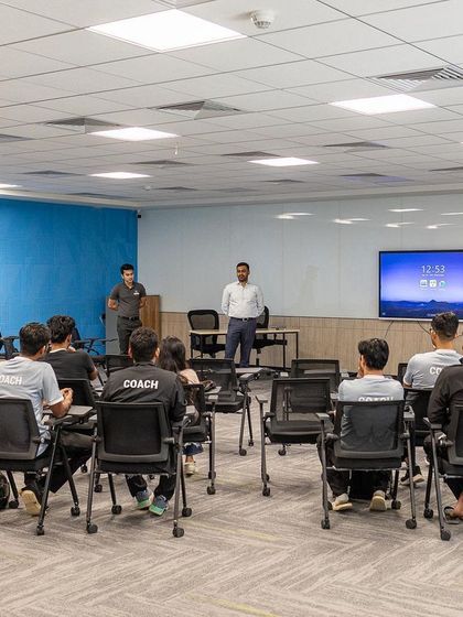 A wide view of a coach education session. It's crucial that the entire support system, including the coaching staff, is aligned on nutrition principles for athlete success.