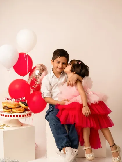 Another precious moment between siblings. A birthday shoot can be a wonderful opportunity to capture the special bond between your children.